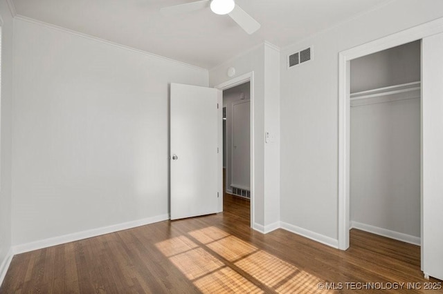 6210 E 17th St, Tulsa, OK 74112 - unfurnished bedroom featuring wood finished floors, a closet, crown molding, baseboards, and a ceiling fan