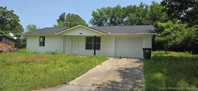 1405 S Cedar St, Bristow, OK 74010 - single story home featuring a garage, driveway, and brick siding