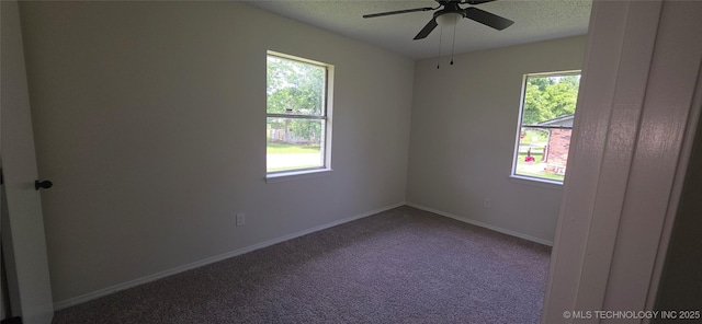 1405 S Cedar St, Bristow, OK 74010 - spare room with carpet, a ceiling fan, a textured ceiling, and baseboards