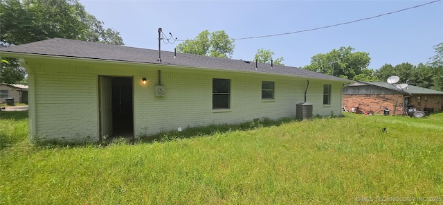 1405 S Cedar St, Bristow, OK 74010 - back of house with brick siding and cooling unit