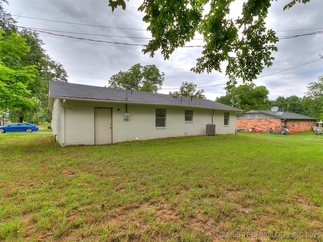 1405 S Cedar St, Bristow, OK 74010 - rear view of property featuring a yard and brick siding