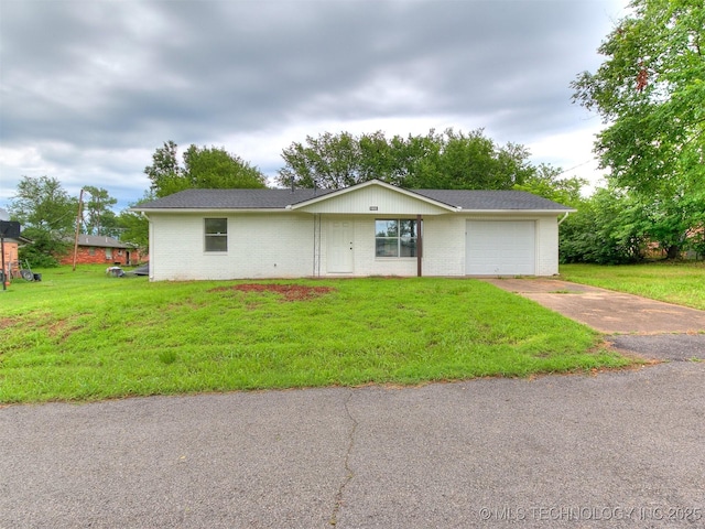 1405 S Cedar St, Bristow, OK 74010 - ranch-style house featuring concrete driveway, an attached garage, brick siding, and a front lawn