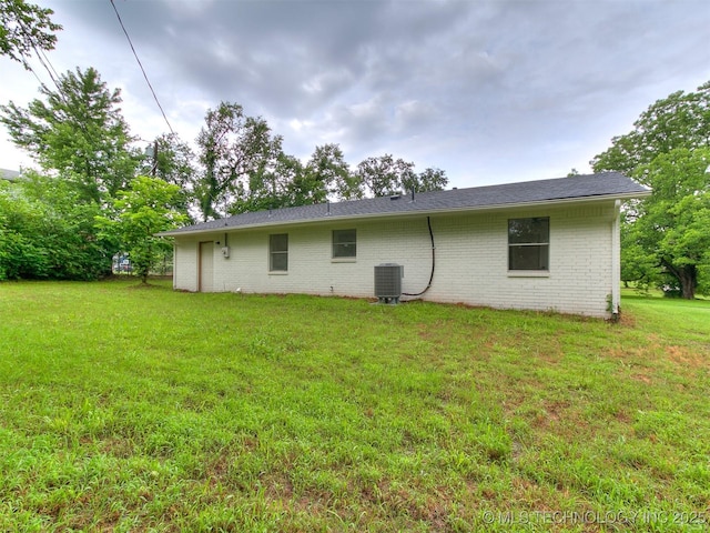 1405 S Cedar St, Bristow, OK 74010 - rear view of house featuring a yard and brick siding