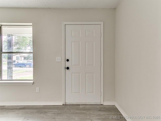 1405 S Cedar St, Bristow, OK 74010 - foyer featuring wood finished floors and baseboards