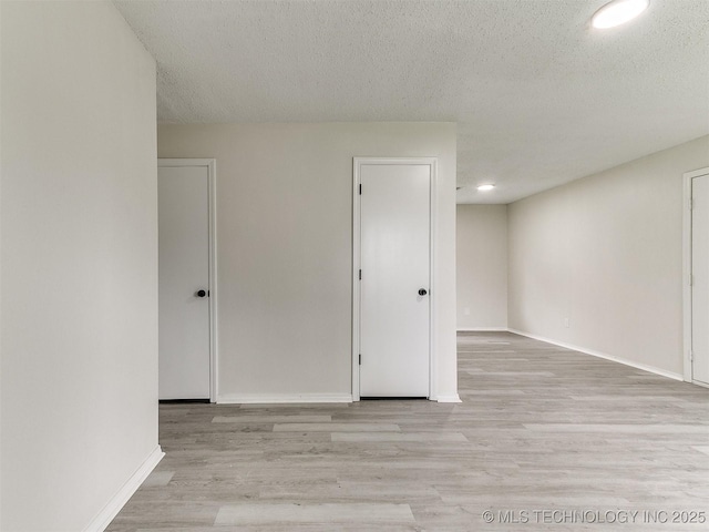 1405 S Cedar St, Bristow, OK 74010 - unfurnished room featuring light wood-type flooring, recessed lighting, and a textured ceiling
