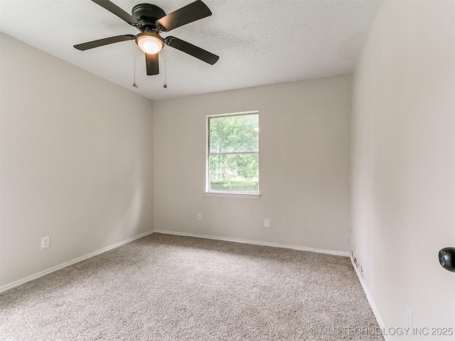 1405 S Cedar St, Bristow, OK 74010 - unfurnished room with carpet, ceiling fan, and a textured ceiling