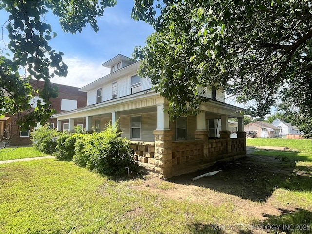 225 E 6th St, Pawhuska, OK 74056 - view of front facade featuring a porch and a front yard