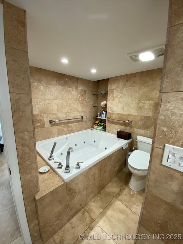 410 W 7th St Unit 1824, Tulsa, OK 74119 - full bathroom with tile walls, toilet, a tub with jets, and tile patterned flooring