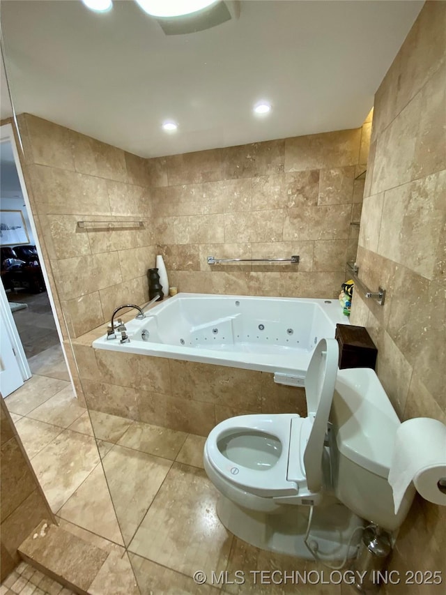410 W 7th St Unit 1824, Tulsa, OK 74119 - bathroom with tile walls, toilet, and a whirlpool tub