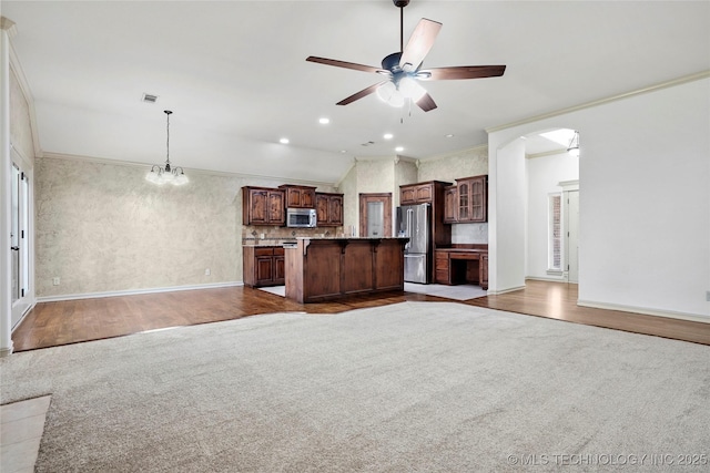 400 E Fargo St, Broken Arrow, OK 74012 - kitchen featuring appliances with stainless steel finishes, open floor plan, ornamental molding, a ceiling fan, and a center island