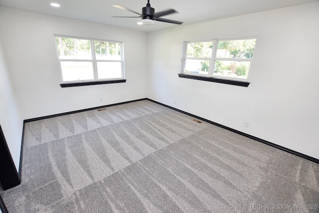 717 N Oklahoma Ave, Tahlequah, OK 74464 - carpeted empty room featuring plenty of natural light, baseboards, a ceiling fan, and recessed lighting
