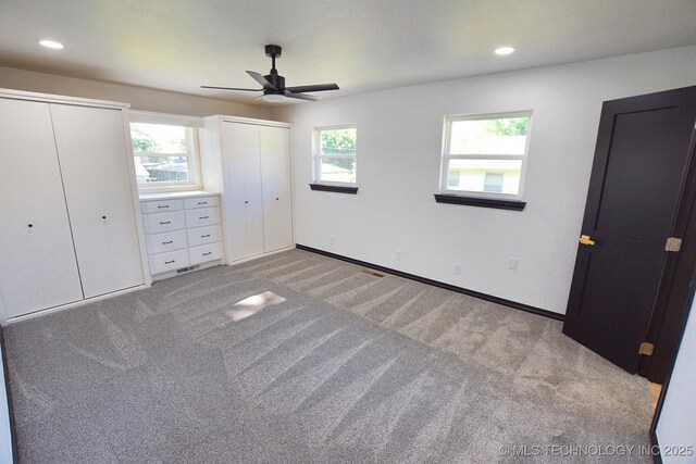 717 N Oklahoma Ave, Tahlequah, OK 74464 - unfurnished bedroom featuring multiple closets, light carpet, recessed lighting, baseboards, and ceiling fan