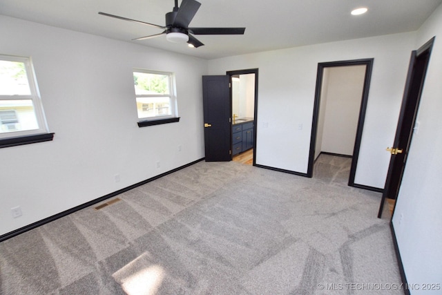 717 N Oklahoma Ave, Tahlequah, OK 74464 - unfurnished bedroom with light carpet, baseboards, recessed lighting, a ceiling fan, and ensuite bath