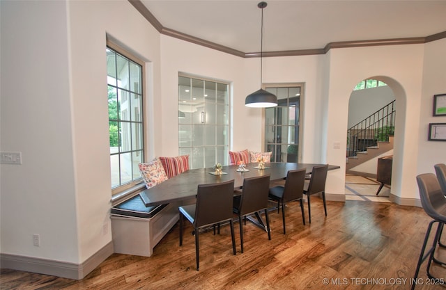 3704 River Bend Rd, Muskogee, OK 74403 - dining room with ornamental molding, wood finished floors, stairs, and baseboards