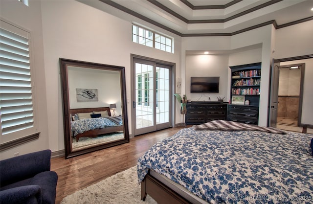 3704 River Bend Rd, Muskogee, OK 74403 - bedroom featuring ornamental molding, a towering ceiling, access to exterior, wood finished floors, and baseboards