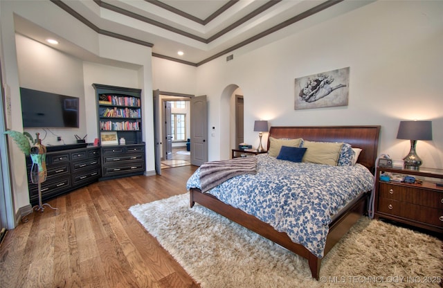 3704 River Bend Rd, Muskogee, OK 74403 - bedroom with arched walkways, wood finished floors, crown molding, recessed lighting, and baseboards