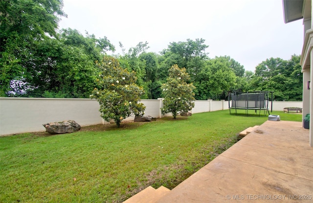 3704 River Bend Rd, Muskogee, OK 74403 - view of yard featuring a trampoline, a patio, and view of wooded area