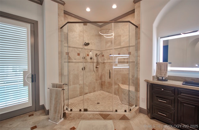 3704 River Bend Rd, Muskogee, OK 74403 - full bath with a stall shower, baseboards, vanity, crown molding, and tile patterned flooring