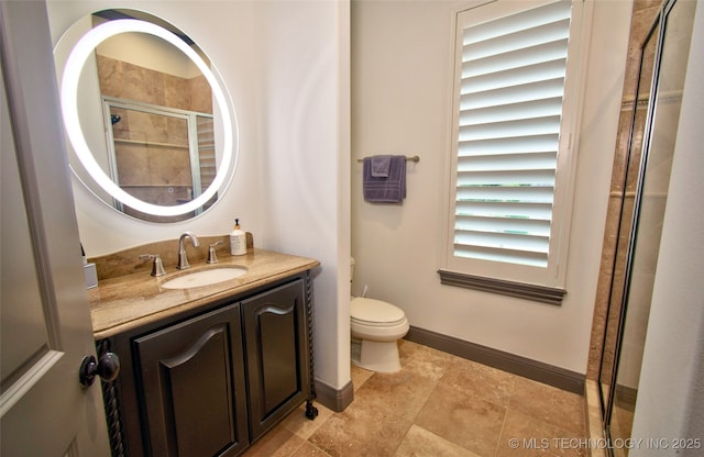 3704 River Bend Rd, Muskogee, OK 74403 - full bathroom with vanity, toilet, tiled shower, and baseboards