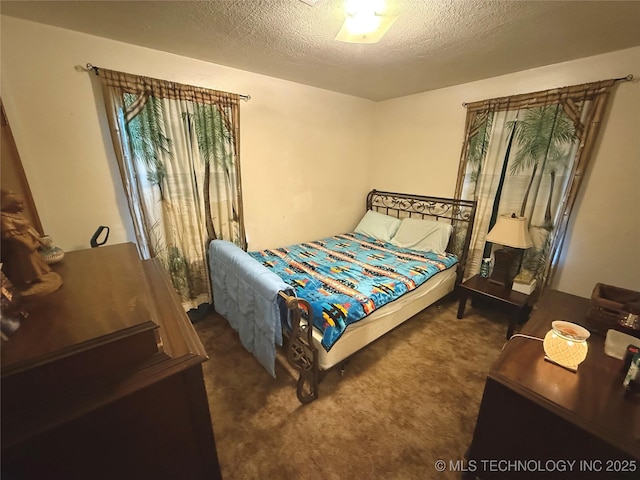 32807 S 250th Rd, Henryetta, OK 74437 - carpeted bedroom with a textured ceiling