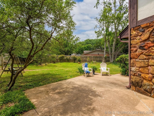 639 Oakridge Dr, Bartlesville, OK 74006 - fenced backyard with a patio