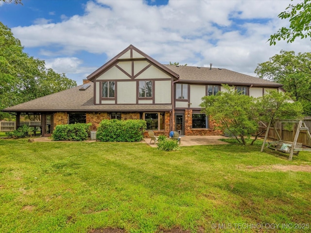 639 Oakridge Dr, Bartlesville, OK 74006 - rear view of house featuring a patio, stucco siding, and roof with shingles