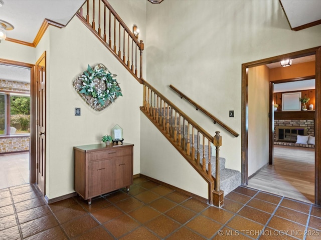 639 Oakridge Dr, Bartlesville, OK 74006 - staircase with crown molding and baseboards