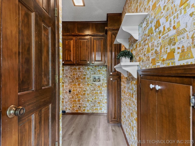 639 Oakridge Dr, Bartlesville, OK 74006 - bar area featuring a textured ceiling, light wood-style floors, and wallpapered walls