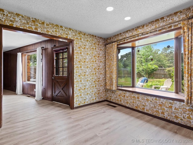 639 Oakridge Dr, Bartlesville, OK 74006 - spare room with a textured ceiling, wood finished floors, and recessed lighting