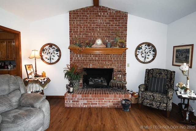 990 Turney Ave, Tahlequah, OK 74464 - living room featuring wood finished floors, vaulted ceiling, and a fireplace