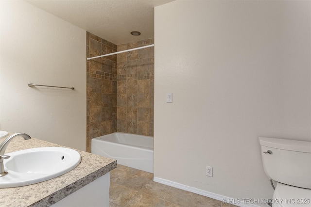 3713 S Poplar Ave, Broken Arrow, OK 74011 - bathroom featuring vanity, toilet, bathing tub / shower combination, and baseboards