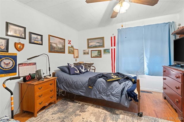 800 N Hwy 10, Gore, OK 74435 - bedroom with wood finished floors, ornamental molding, and ceiling fan