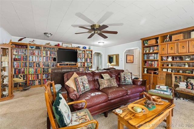 800 N Hwy 10, Gore, OK 74435 - living room featuring carpet floors, a ceiling fan, and arched walkways