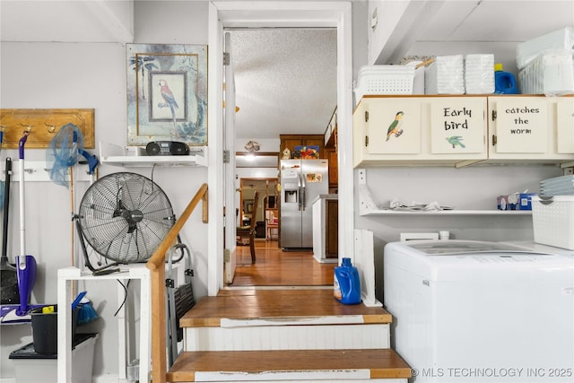 800 N Hwy 10, Gore, OK 74435 - washroom with washer / dryer, cabinet space, and a textured ceiling