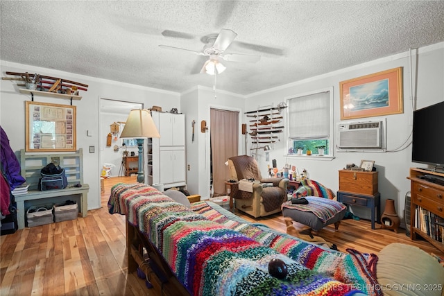 800 N Hwy 10, Gore, OK 74435 - living room with a textured ceiling, an AC wall unit, hardwood / wood-style flooring, ceiling fan, and ornamental molding