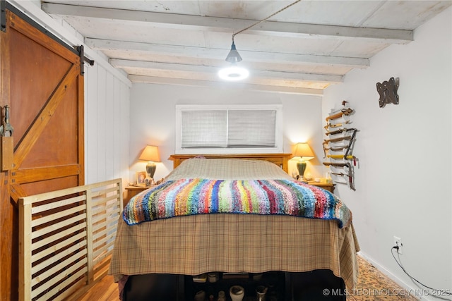 800 N Hwy 10, Gore, OK 74435 - bedroom featuring a barn door, beamed ceiling, and baseboards