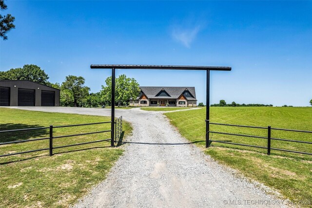 35795 E 231st St S, Porter, OK 74454 - view of dirt / gravel driveway featuring a rural view and a gated entry