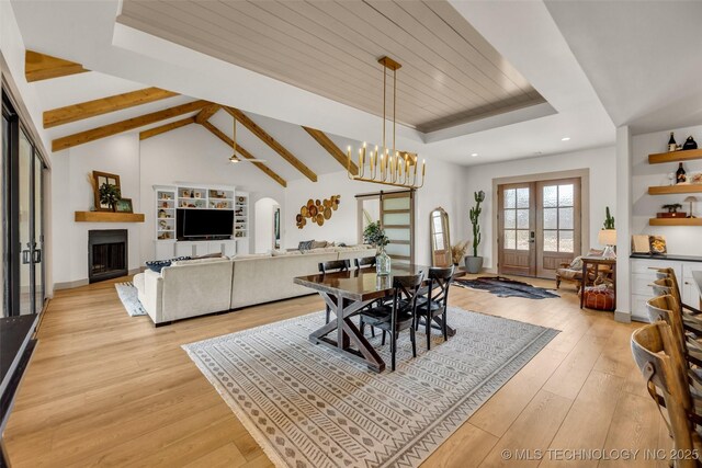 35795 E 231st St S, Porter, OK 74454 - dining room featuring arched walkways, light wood finished floors, a fireplace, wooden ceiling, and french doors
