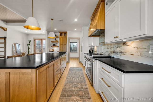 35795 E 231st St S, Porter, OK 74454 - kitchen featuring high end range, light wood-style floors, dark countertops, premium range hood, and open shelves