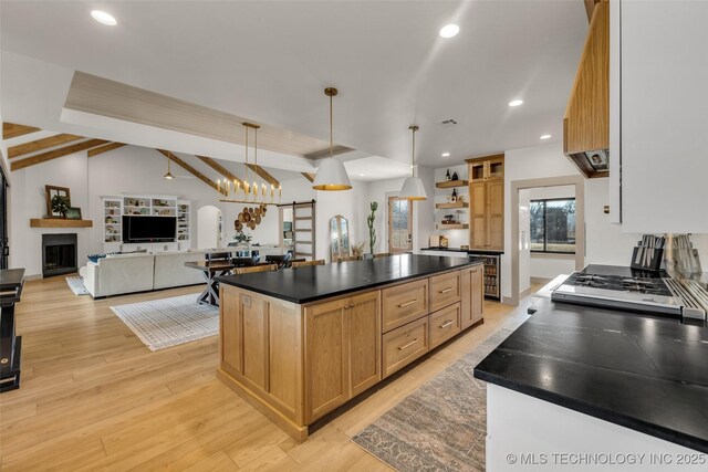 35795 E 231st St S, Porter, OK 74454 - kitchen with open shelves, dark countertops, beverage cooler, light wood-type flooring, and a center island