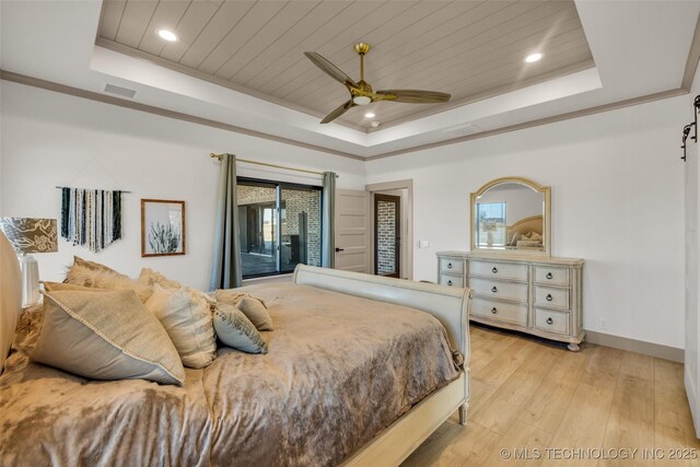 35795 E 231st St S, Porter, OK 74454 - bedroom featuring a tray ceiling, light wood-style flooring, multiple windows, recessed lighting, and baseboards