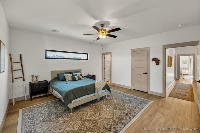 35795 E 231st St S, Porter, OK 74454 - bedroom featuring light wood-style floors, baseboards, and ceiling fan