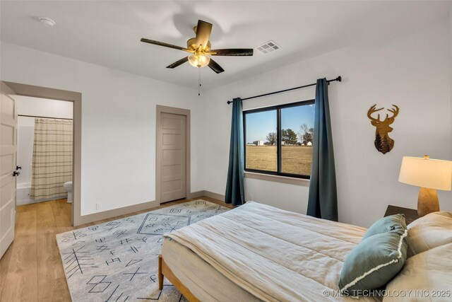 35795 E 231st St S, Porter, OK 74454 - bedroom featuring light wood-type flooring, ensuite bath, and baseboards