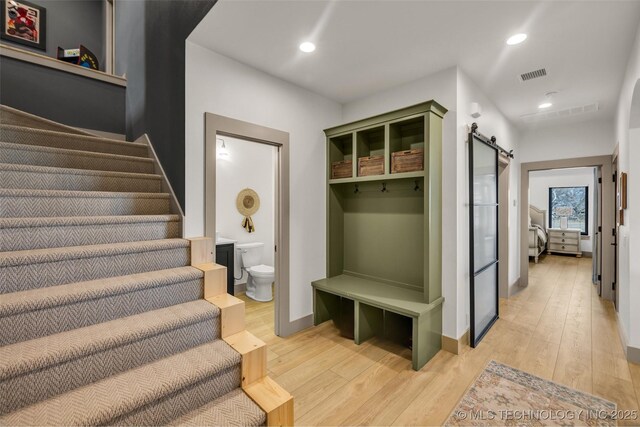 35795 E 231st St S, Porter, OK 74454 - mudroom featuring light wood finished floors, a barn door, recessed lighting, and baseboards