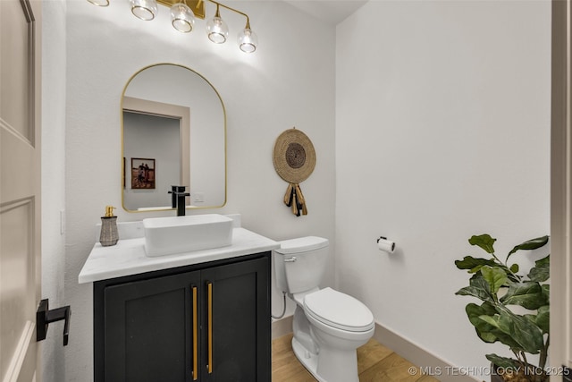 35795 E 231st St S, Porter, OK 74454 - half bathroom with toilet, vanity, wood finished floors, and baseboards
