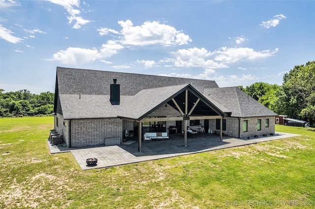 35795 E 231st St S, Porter, OK 74454 - rear view of property with a patio area, a lawn, brick siding, a chimney, and roof with shingles