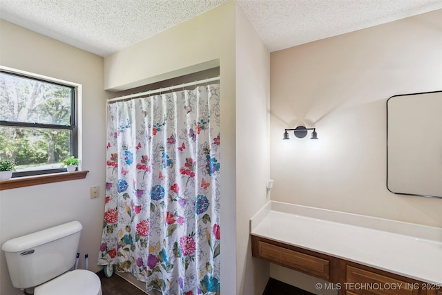 22547 S Dogwood Ct, Claremore, OK 74019 - full bathroom featuring a textured ceiling, vanity, and a shower with shower curtain