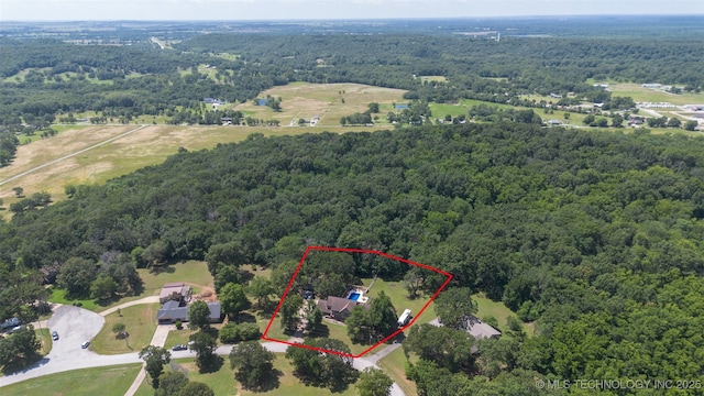 22547 S Dogwood Ct, Claremore, OK 74019 - aerial view of property and surrounding area featuring a heavily wooded area and property boundaries highlighted