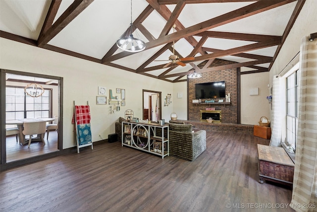 22547 S Dogwood Ct, Claremore, OK 74019 - living room featuring beamed ceiling, wood finished floors, a fireplace, a chandelier, and plenty of natural light