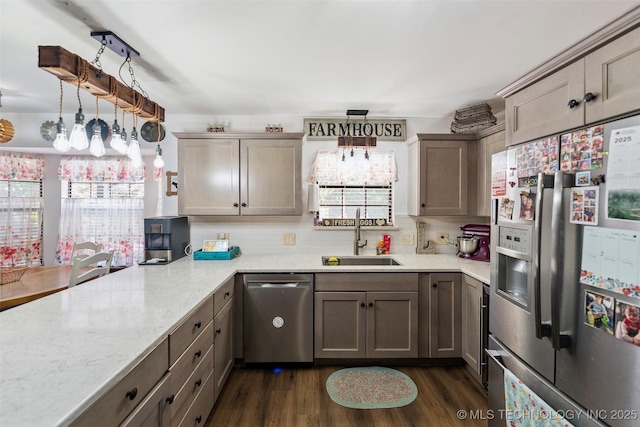22547 S Dogwood Ct, Claremore, OK 74019 - kitchen featuring appliances with stainless steel finishes, backsplash, dark wood finished floors, and light stone countertops